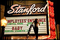 Neon signs and movie title being rearranged, Stanford Theater. Palo Alto,  California, USA (color)