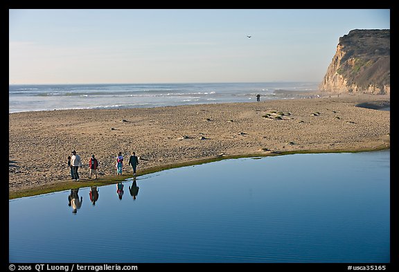 Family walking by lagoon, Scott Creek Beach. California, USA (color)