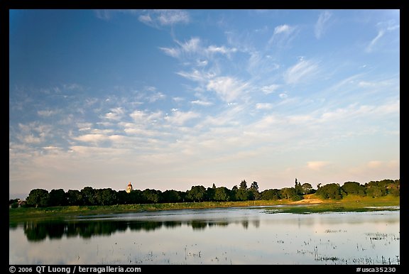 Lake Lagunata and Hoover tower behind row of trees, late afternoon. Stanford University, California, USA