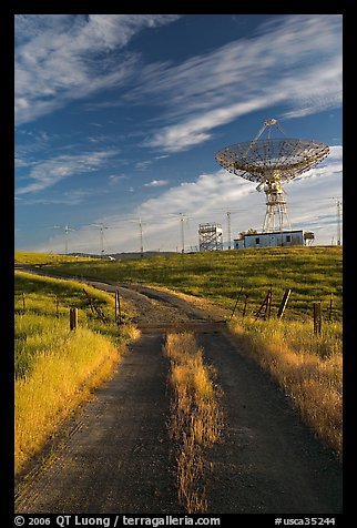 Gravel road leading to parabolic antenna, late afternoon. Stanford University, California, USA