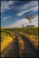 Gravel road leading to parabolic antenna, late afternoon. Stanford University, California, USA (color)