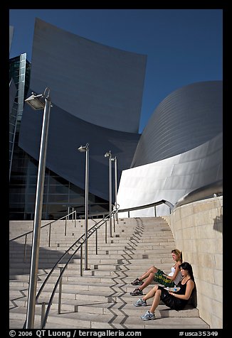 Women sunning on the steps of the entrance of the Walt Disney Concert Hall. Los Angeles, California, USA (color)