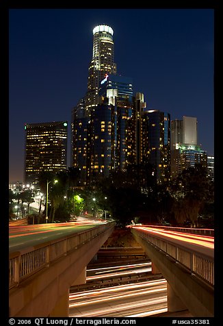 Bridge above Harbor Freeway and US Bank building at night. Los Angeles, California, USA