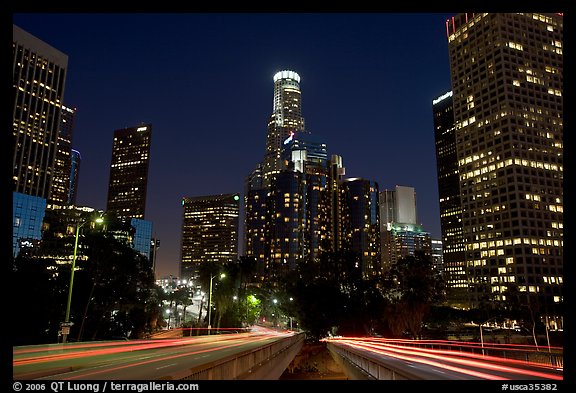 Traffic lights and skyline at night. Los Angeles, California, USA