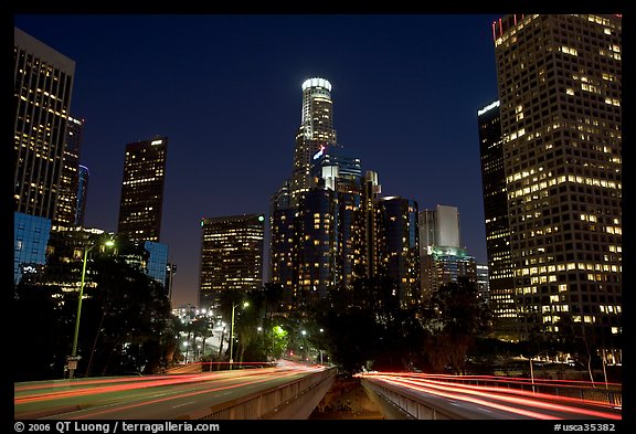 Traffic lights and skyline at night. Los Angeles, California, USA (color)