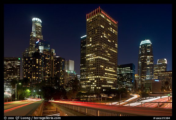 Bridge, traffic lights and Los Angeles skyline at night. Los Angeles, California, USA (color)