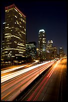 Traffic on Harbor Freeway and skyline at night. Los Angeles, California, USA