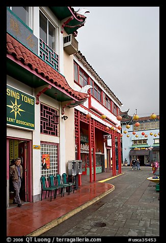 Man at doorway and plaza, Chinatown. Los Angeles, California, USA