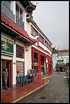 Man at doorway and plaza, Chinatown. Los Angeles, California, USA