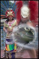 Aztec dancers in motion,  El Pueblo historic district. Los Angeles, California, USA