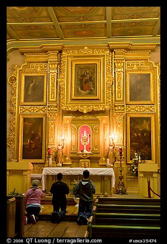 Prayer at altar in Mission Chapel. Los Angeles, California, USA