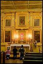 Prayer at altar in Mission Chapel. Los Angeles, California, USA