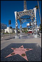 Star from the Hollywood walk of fame and gazebo with statues of actresses. Hollywood, Los Angeles, California, USA