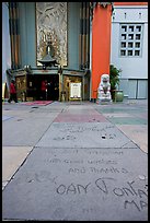 Handprints and footprints of actors and actresses in cement, Grauman theater forecourt. Hollywood, Los Angeles, California, USA