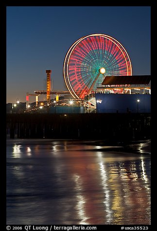 Ferris Wheel in motion at nightfall. Santa Monica, Los Angeles, California, USA