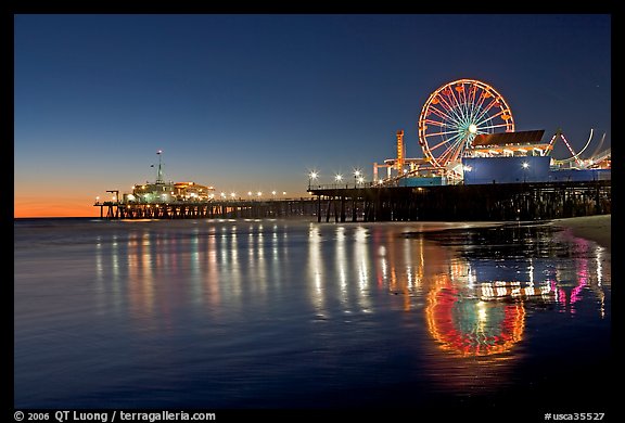 Pier, Ferris Wheel, and reflections  at dusk. Santa Monica, Los Angeles, California, USA