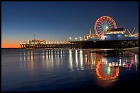 Pier, Ferris Wheel, and reflections  at dusk. Santa Monica, Los Angeles, California, USA