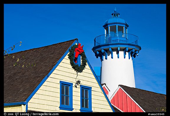 Brighly painted houses and lightouse, Fishermans village. Marina Del Rey, Los Angeles, California, USA