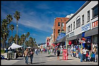 Couple strolling on Venice Boardwalk. Venice, Los Angeles, California, USA (color)