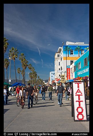 Tatoo sign and colorful Ocean Front Walk. Venice, Los Angeles, California, USA