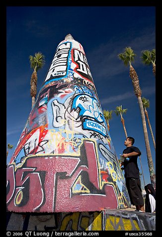 Man creating  graffiti art. Venice, Los Angeles, California, USA (color)