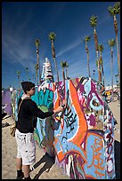 Young man making graffiti on a wall. Venice, Los Angeles, California, USA (color)