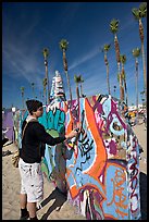 Young man making graffiti on a wall. Venice, Los Angeles, California, USA