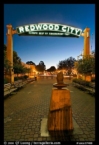 Plaza with Climate Best by Government Test sign at night. Redwood City,  California, USA (color)