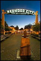 Plaza with Climate Best by Government Test sign at night. Redwood City,  California, USA (color)