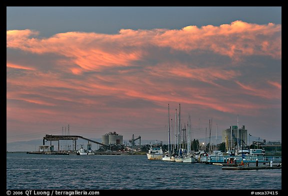 Yachts and industrial installations, port of Redwood, sunset. Redwood City,  California, USA
