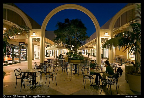 Sitting at outdoor table at night, Stanford Shopping Center. Stanford University, California, USA