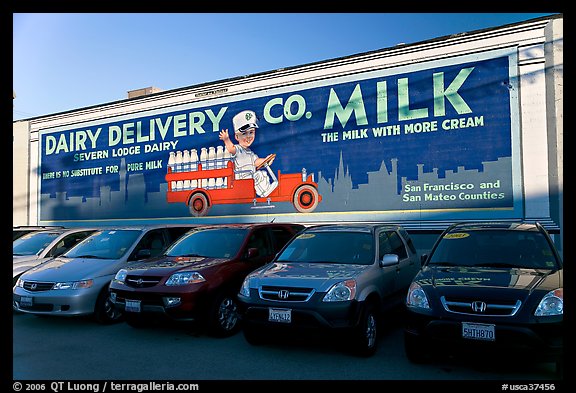 Historic advertising mural, in a car dealership lot. Burlingame,  California, USA (color)