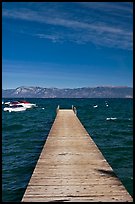 Dock, small boats, and blue waters, West shore, Lake Tahoe, California. USA