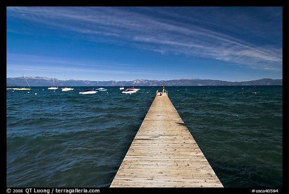 Dock, small boats, and blue waters and mountains, Lake Tahoe, California. USA