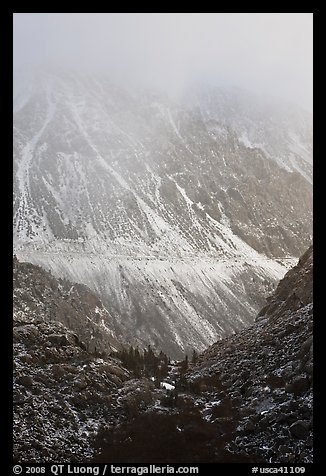 Mountains cut by Tioga Pass road with fresh snow. California, USA