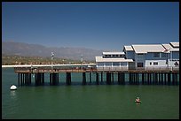 Man on buoy and pier. Santa Barbara, California, USA