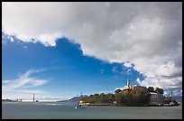 Golden Gate Bridge and Alcatraz under large cloud. San Francisco, California, USA