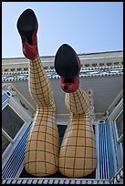 Legs with fishnet stockings hanging from a window, Haight-Ashbury District. San Francisco, California, USA