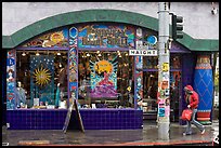 Rainny sidewalk and store with psychadelic colors. San Francisco, California, USA