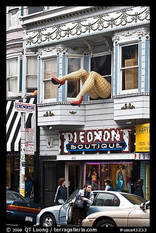 Woman exiting car below women legs with stockings. San Francisco, California, USA