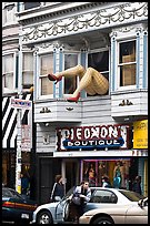 Woman exiting car below women legs with stockings. San Francisco, California, USA (color)