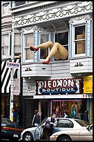 Woman exiting car below women legs with stockings. San Francisco, California, USA