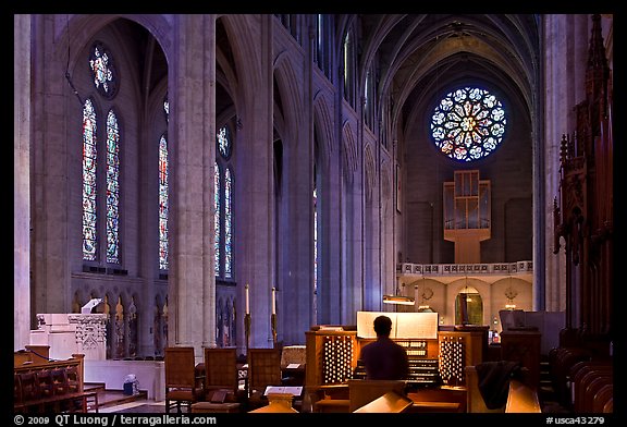 Church organist playing inside Grace Cathedral. San Francisco, California, USA