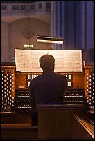 Musician playing organ, Grace Cathedral. San Francisco, California, USA (color)