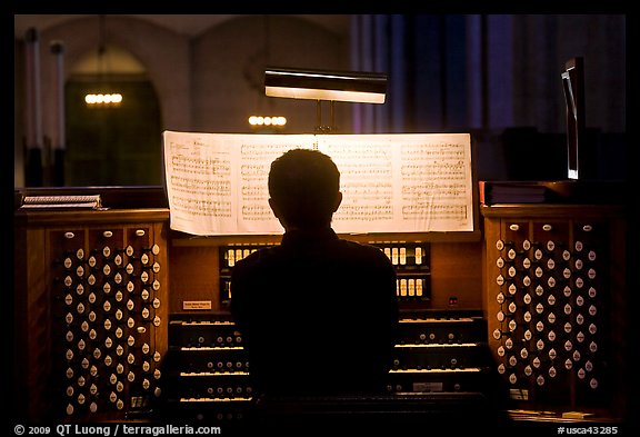 Organist and musical score, Grace Cathedral. San Francisco, California, USA (color)