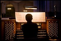 Organist and musical score, Grace Cathedral. San Francisco, California, USA (color)