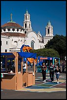 School fair booth, children, and Mission Dolores in the background. San Francisco, California, USA