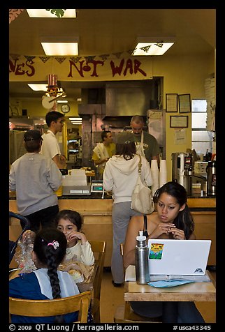 Tables and counter inside pizza restaurant, Haight-Ashbury district. San Francisco, California, USA (color)