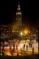 Ice rink and Ferry Building tower at night. San Francisco, California, USA