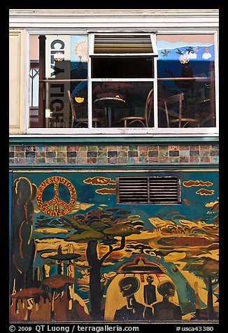 Decor from beatnik period and window reflecting city light sign, North Beach. San Francisco, California, USA (color)